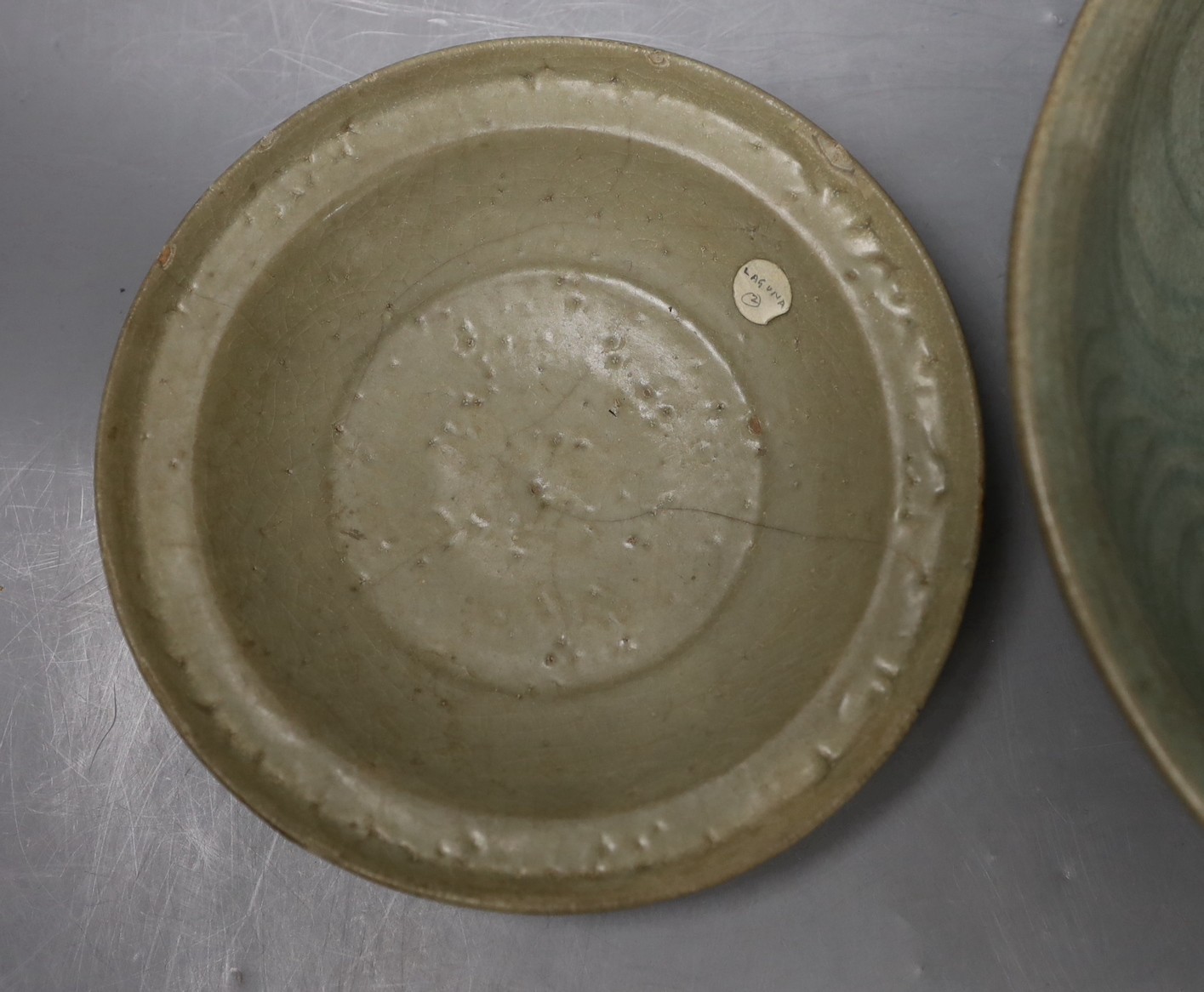 A Chinese celadon dish, probably Southern Song Dynasty, 17.5cm and a Thai Sawankhalok celadon deep dish, 16th century, largest 27cm